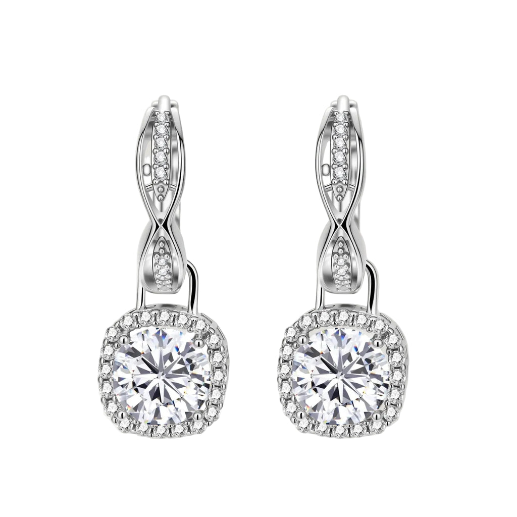 Sterling silver twisted hoop earrings with round moissanite stones in halo settings against neutral background.