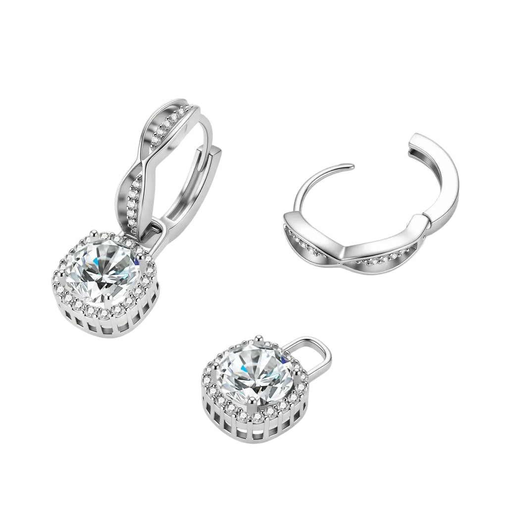 Sterling silver twisted hoop earrings with round moissanite stones in halo settings against neutral background.