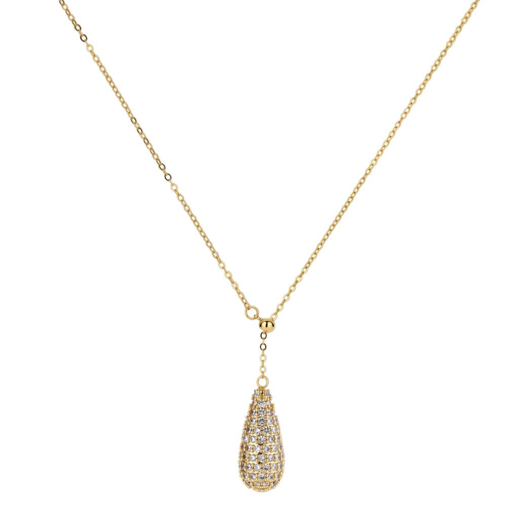 Gold-plated teardrop necklace and earrings covered in AAA cubic zirconia crystals on cream background.