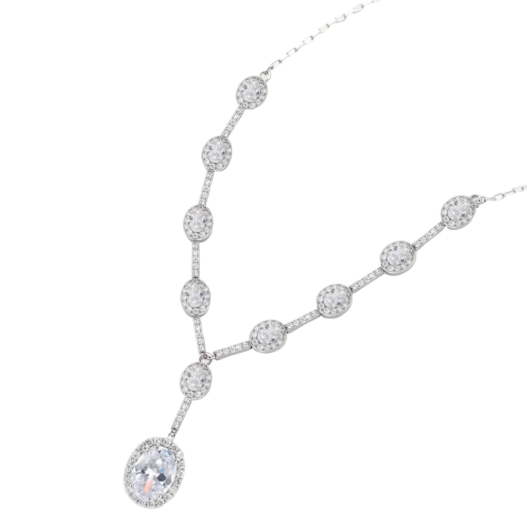 Elegant white gold plated jewelry set with oval cubic zirconia stones in halo settings, featuring Y-necklace and drop earrings.