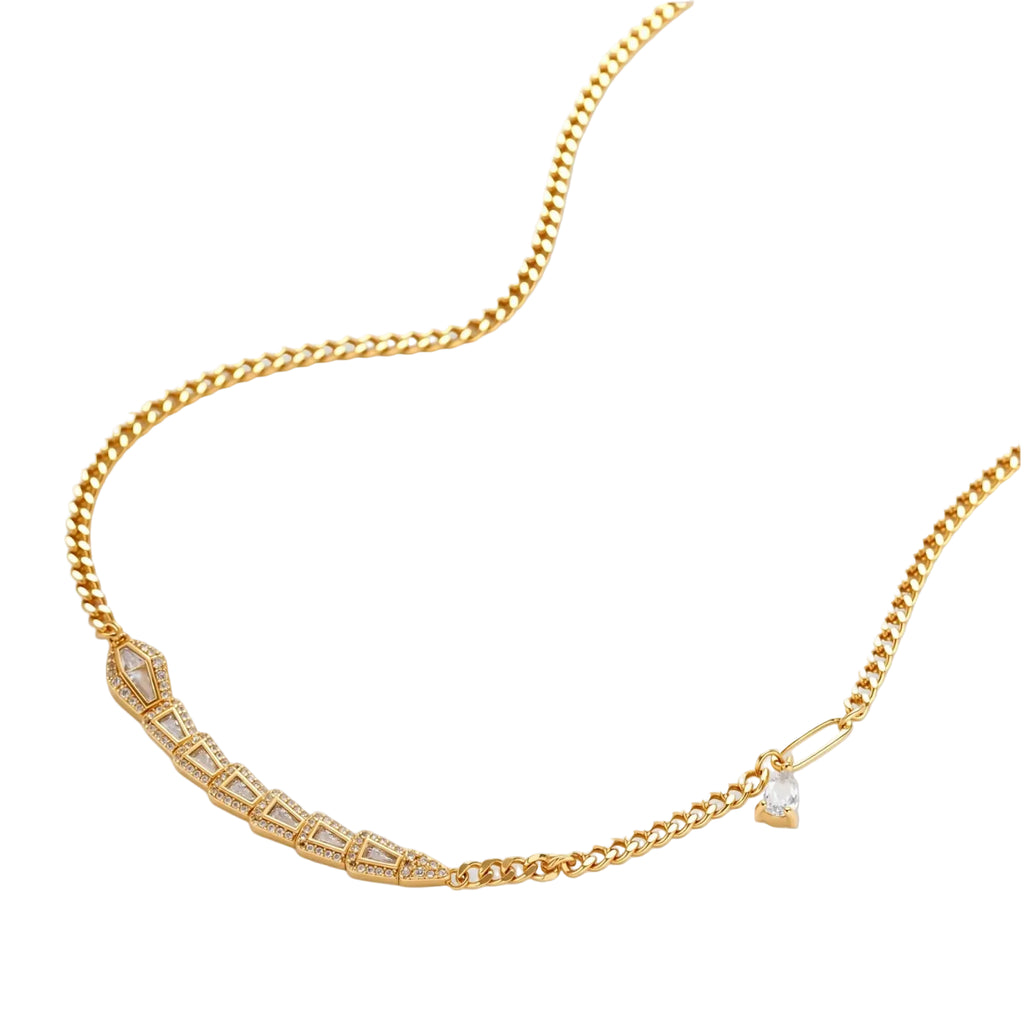 Gold-plated necklace with geometric diamond segments and matching huggie earrings featuring cubic zirconia details