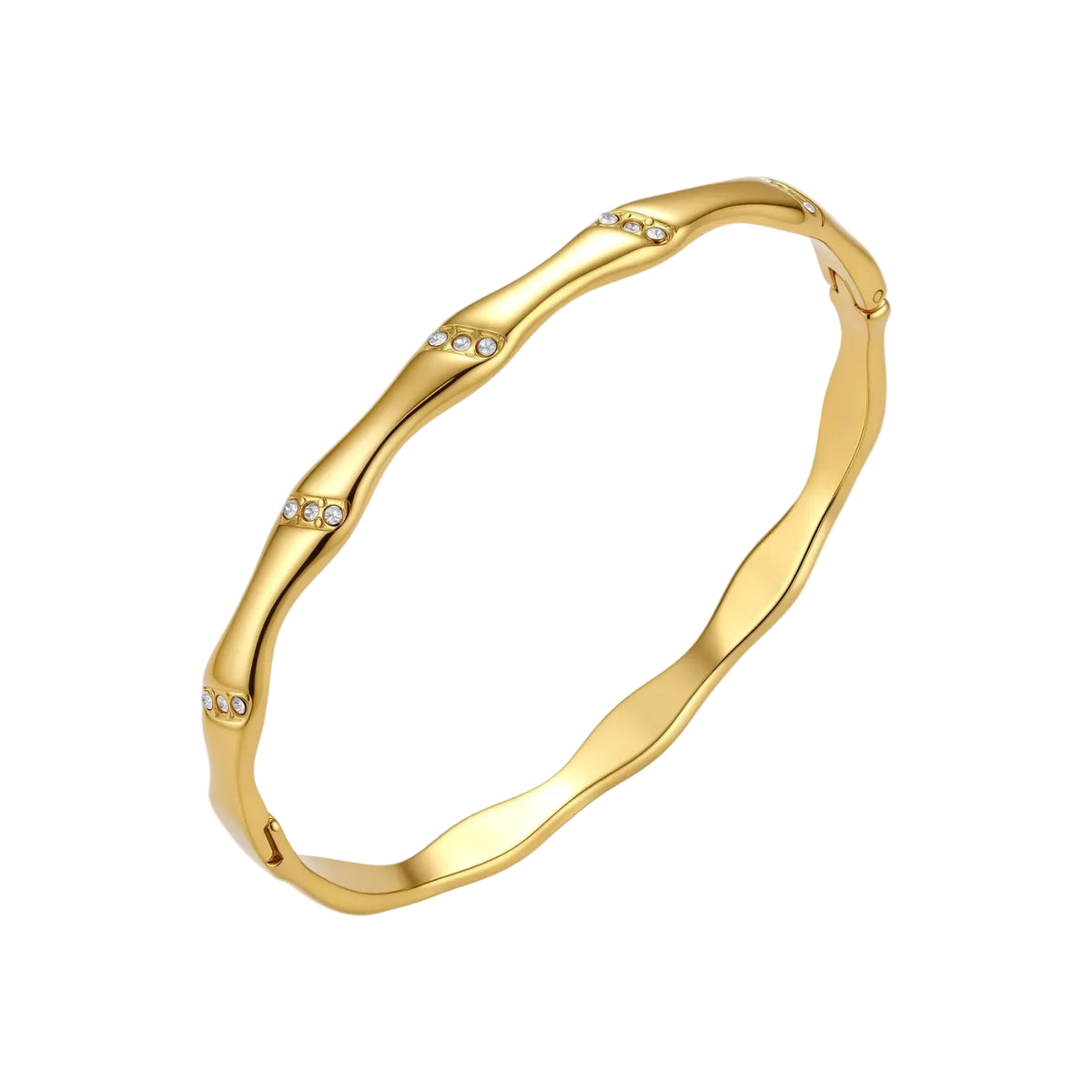 Gold-toned wavy bangle with bamboo-style segments and CZ crystal clusters on cream background. 18K plated stainless steel.