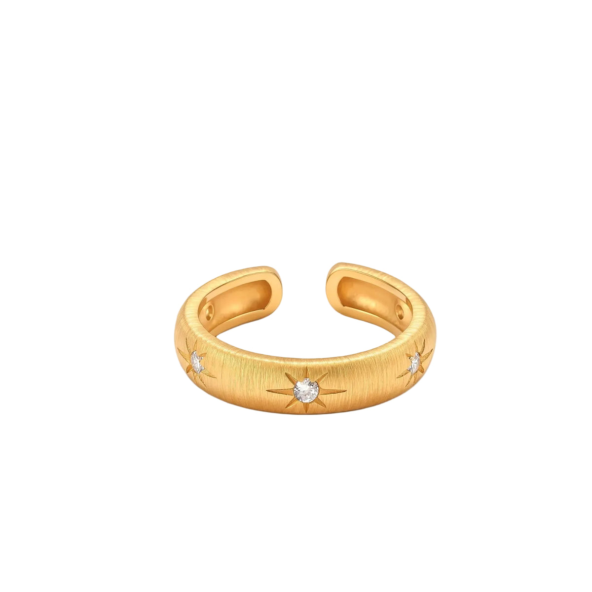 Gold open-band cuff ring with brushed matte finish, engraved 8-point star motifs, and round CZ stones on white background.